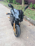 Venom Super Pocket Bike x19 Pocket Rocket 110cc in black facing forward with big rear view mirrors, motorcycle tires, front headlight ready to drive