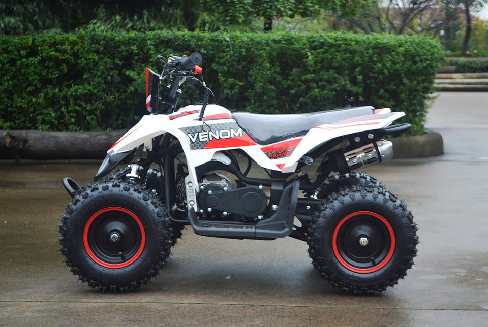 49cc Mini Quad ATV in red/white combo parked sideways revealing left side of ATV revealing matching red rims
