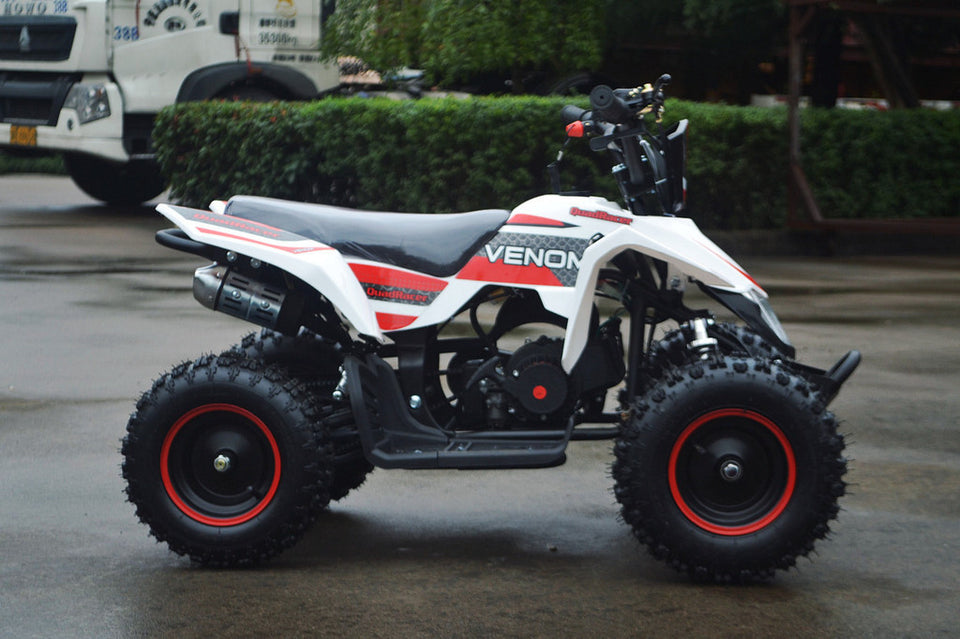 49cc Mini Quad ATV in red/white combo parked sideways revealing the right side of ATV and 49cc engine and red matching rims