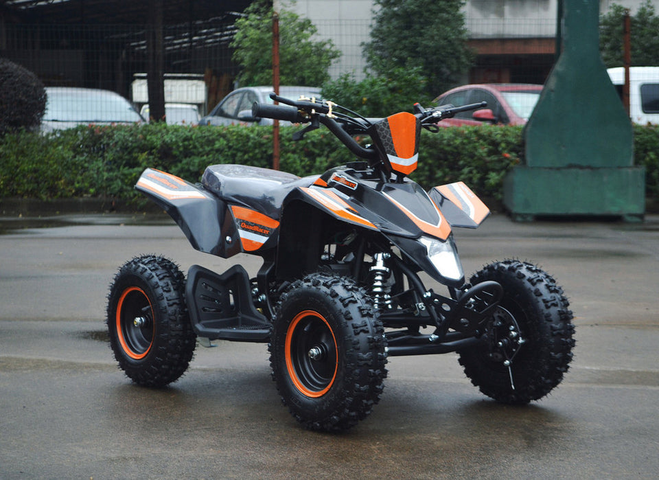 49cc Mini Quad ATV in orange/black combo parked diagonally facing forward to the right