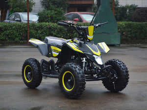 49cc Mini Quad ATV in yellow/black combo parked diagonally facing forward to the right