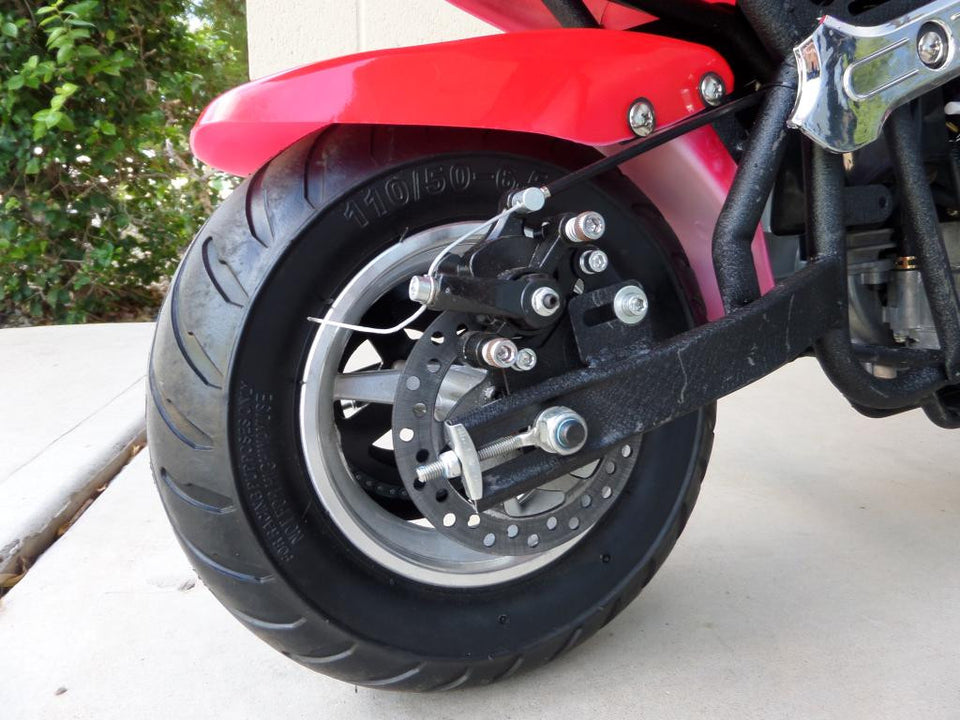 Red and black 40cc premium gas pocket bike 4-stroke rear tire close up