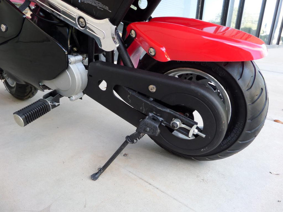Red and black 40cc premium gas pocket bike 4-stroke rear tire close up and bike stand.